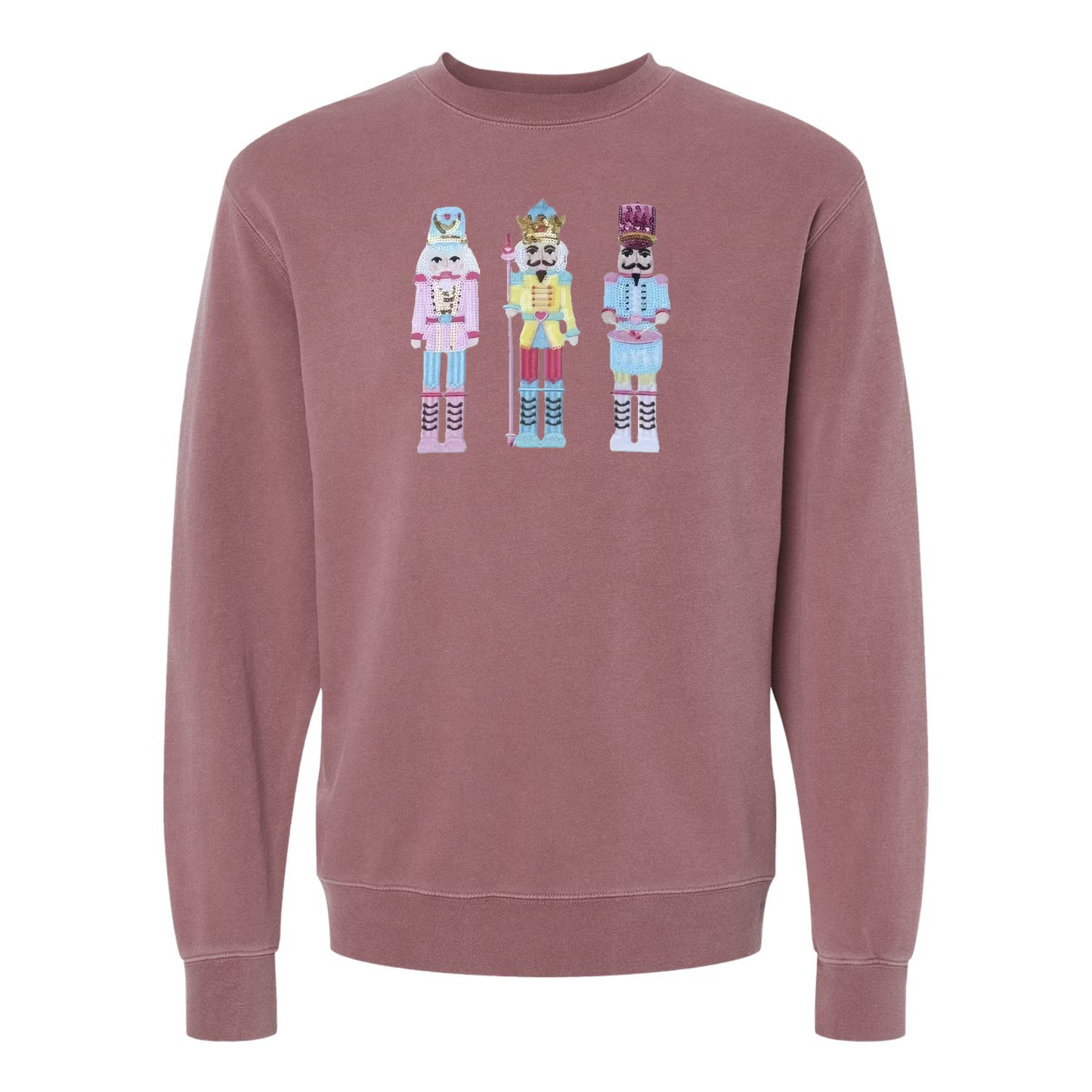 Mauve sweatshirt with nutcracker design on a white background