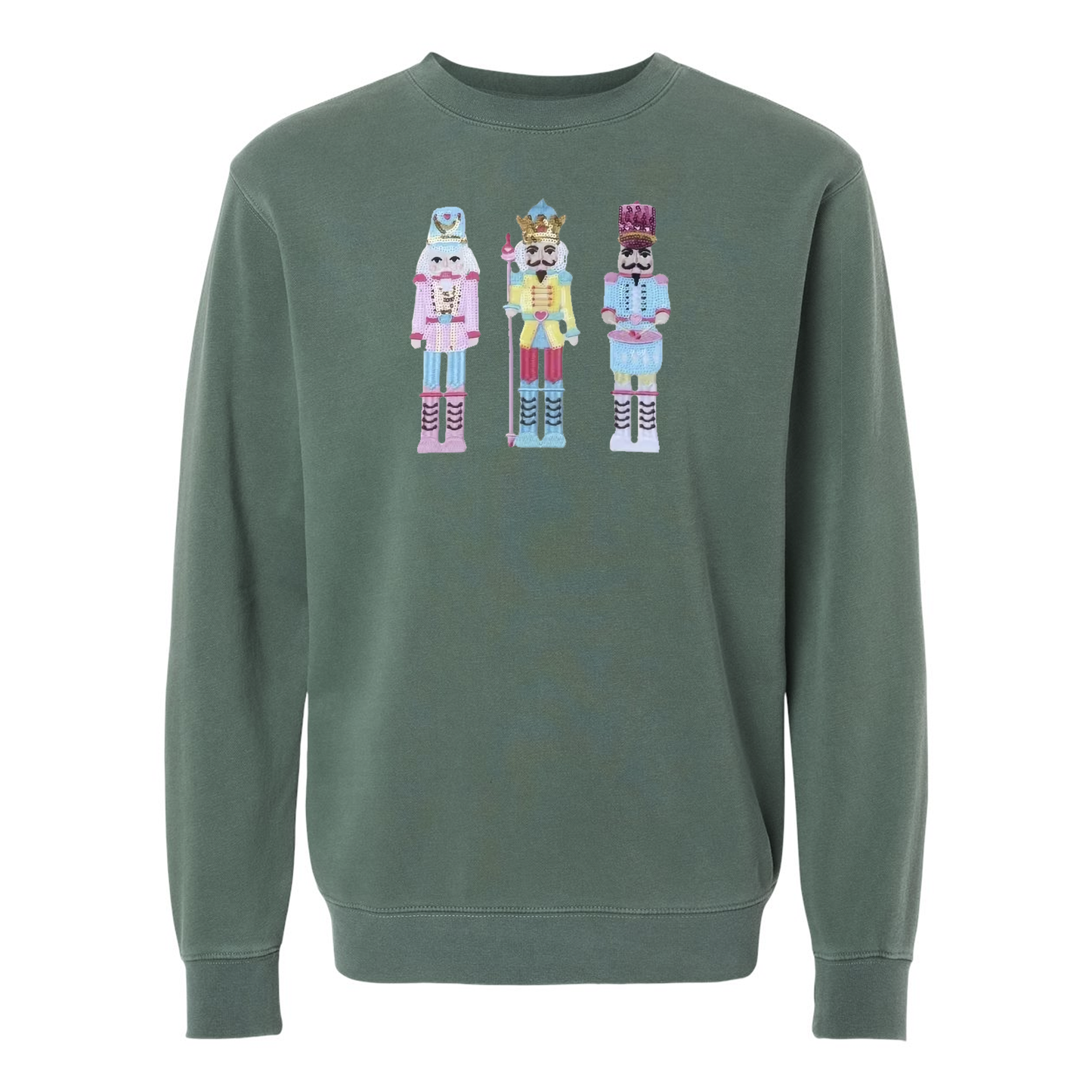Flat lay of nutcracker appliqué pigment-dyed crewneck sweatshirt in green