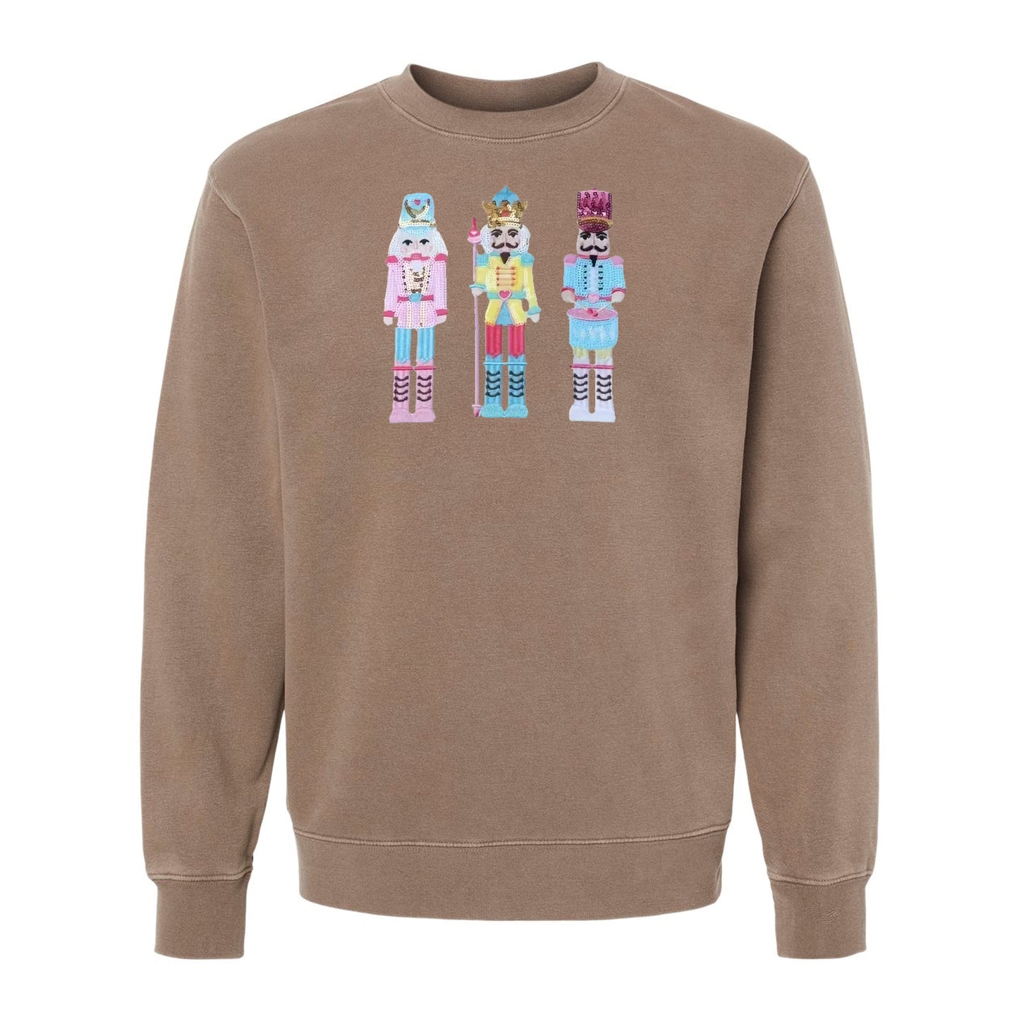 Flat lay of nutcracker appliqué pigment-dyed crewneck sweatshirt in beige