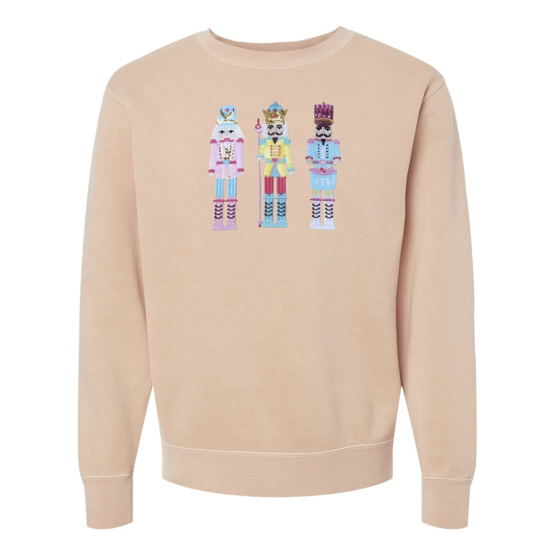 Flat lay of nutcracker appliqué pigment-dyed crewneck sweatshirt in dusty pink